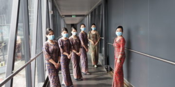 singapore airlines - cabin crew with ppe